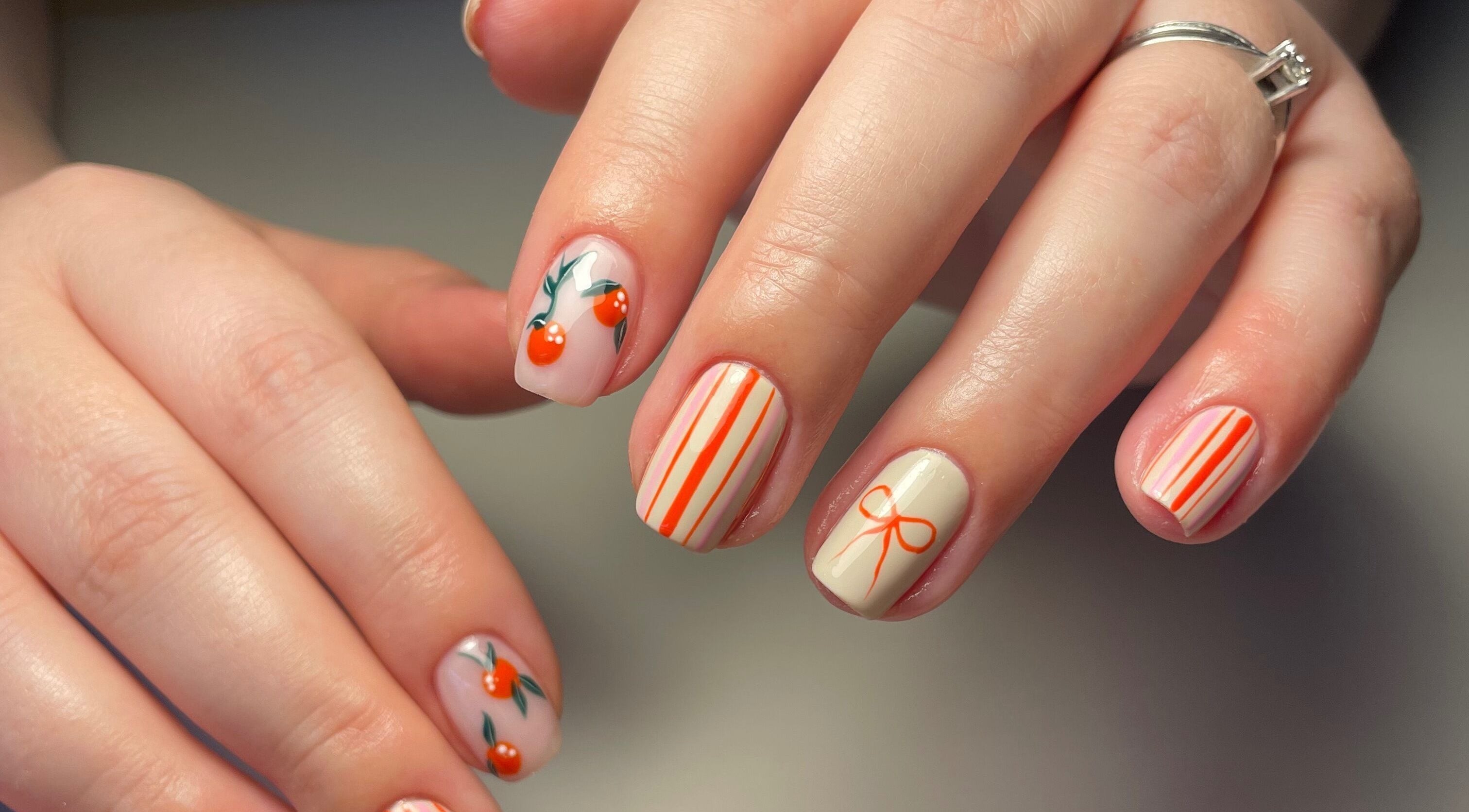 Stylish cherry nail art at Beauty by Sara in Uttoxeter, England, GB, showcasing vibrant designs.