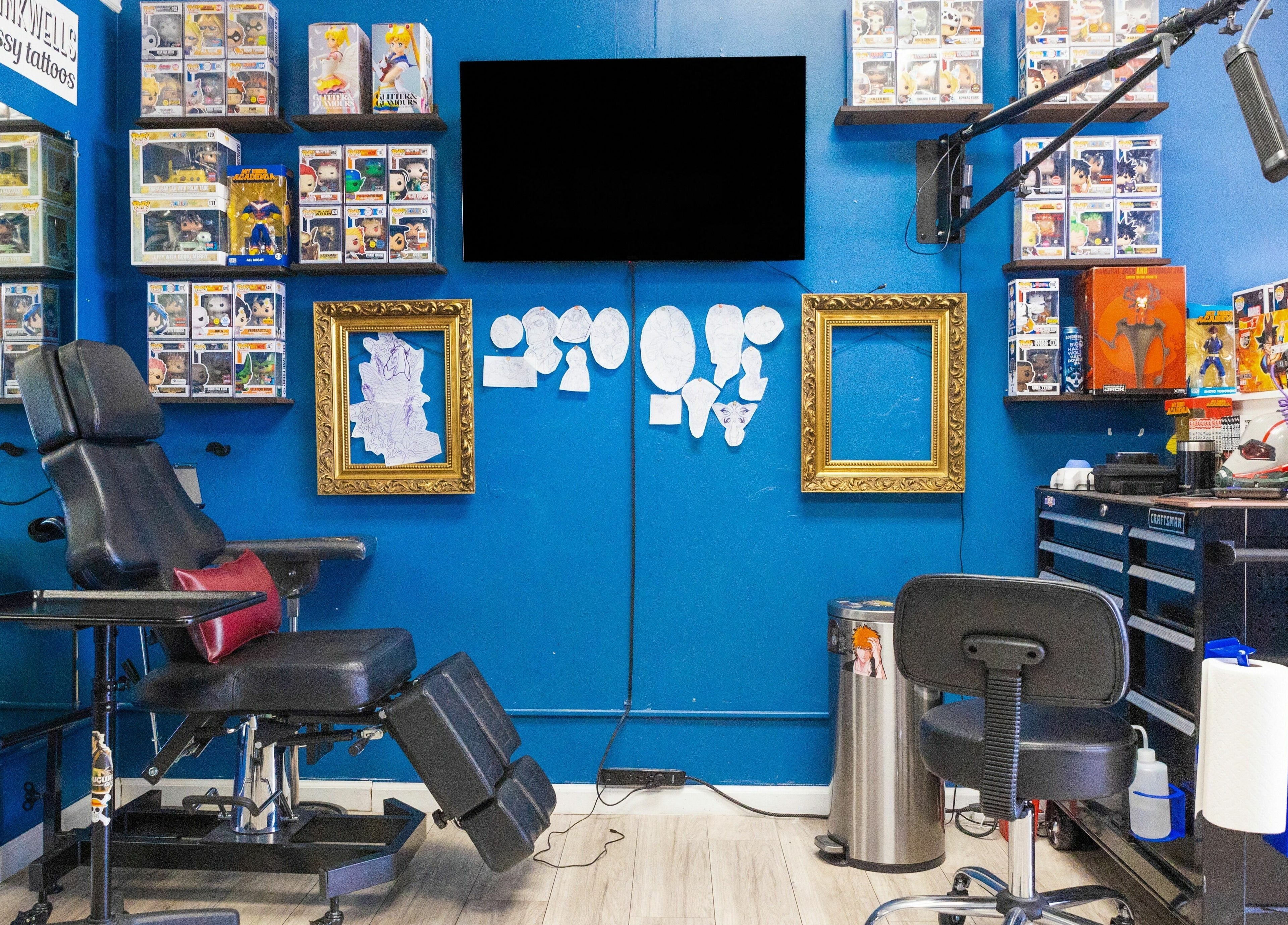 Tattoo studio at Mr. Inkwells, Los Alamitos, California, US, featuring a stylish chair and vibrant decor.