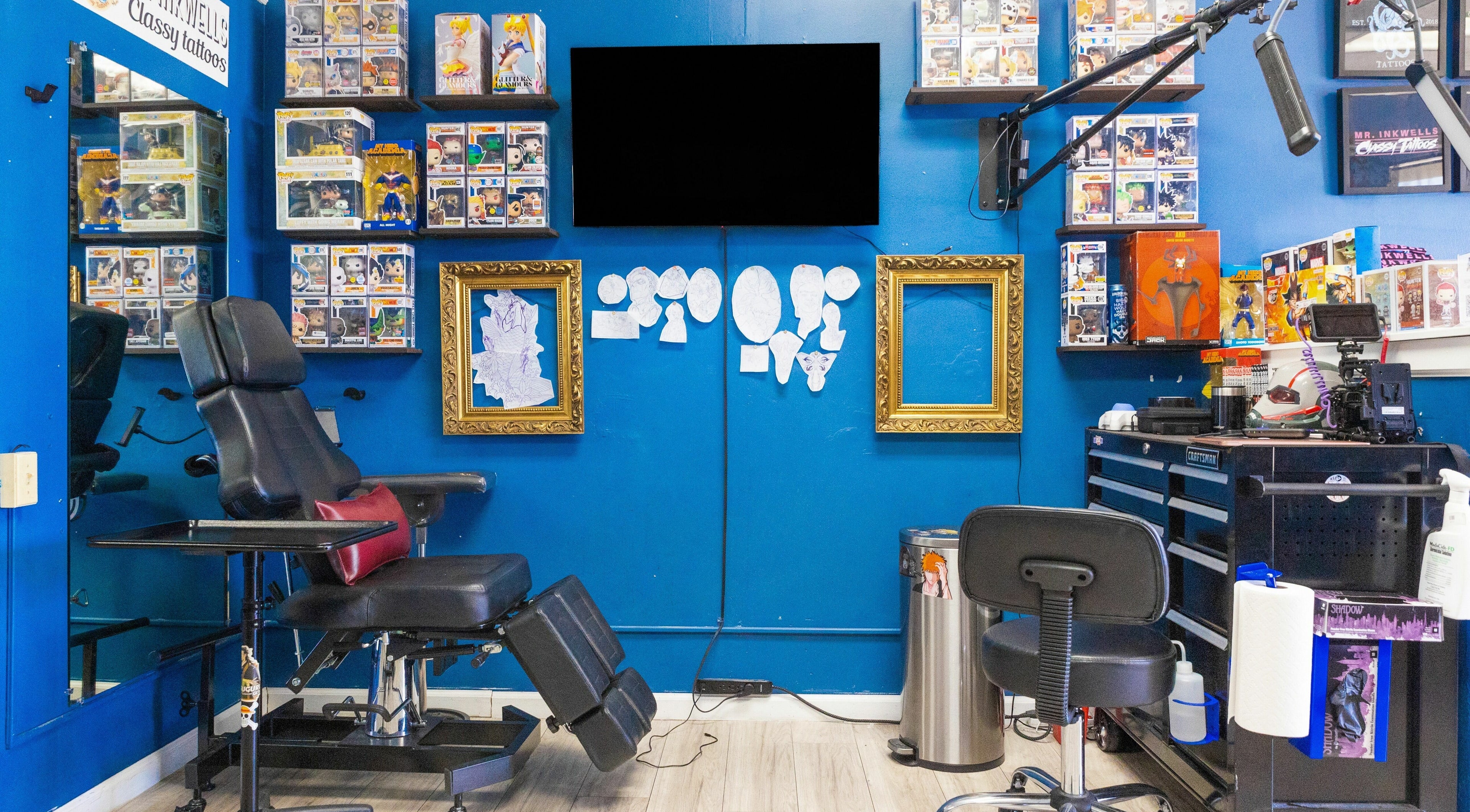 Tattoo studio at Mr. Inkwells, Los Alamitos, California, US, featuring a stylish chair and vibrant decor.