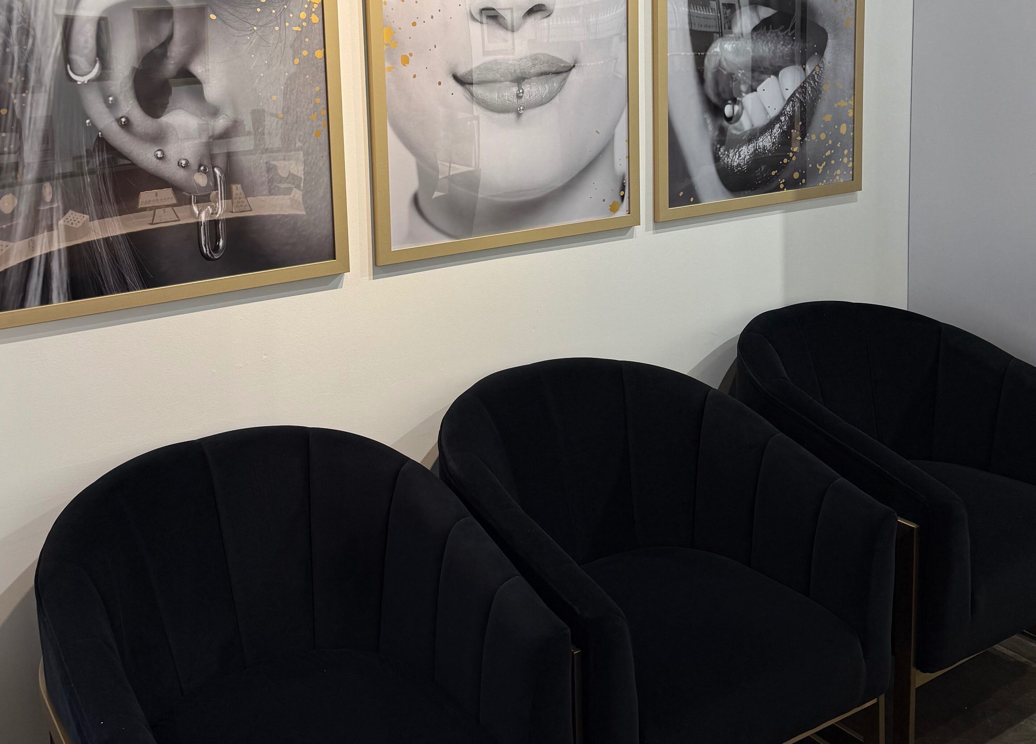 Stylish waiting area with art at Mr.Inkwells Piercing Studio MV, Mission Viejo, California, US.