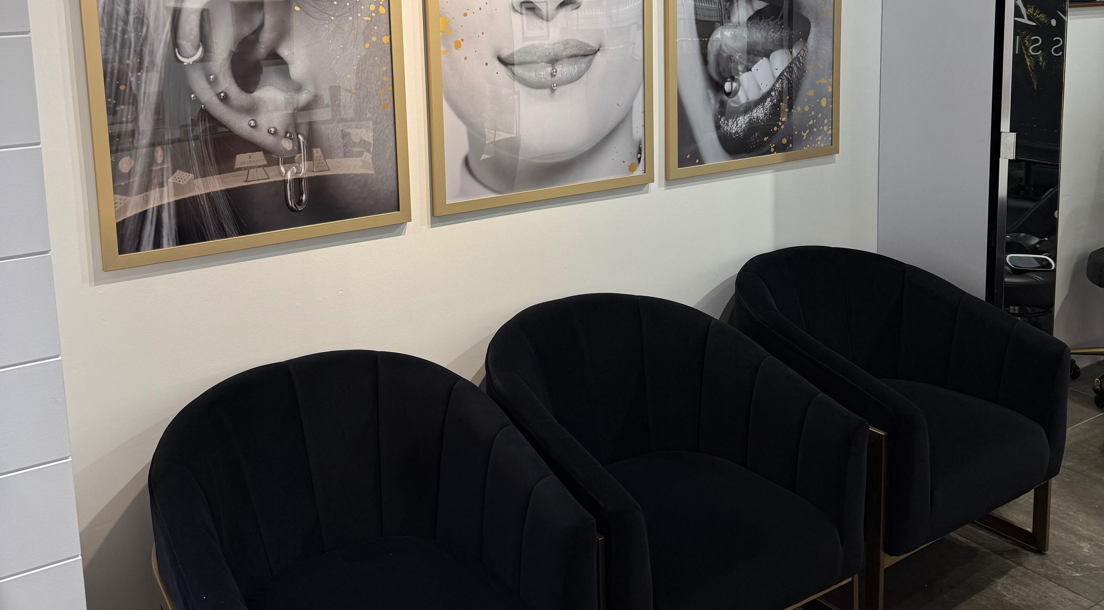 Stylish waiting area with art at Mr.Inkwells Piercing Studio MV, Mission Viejo, California, US.