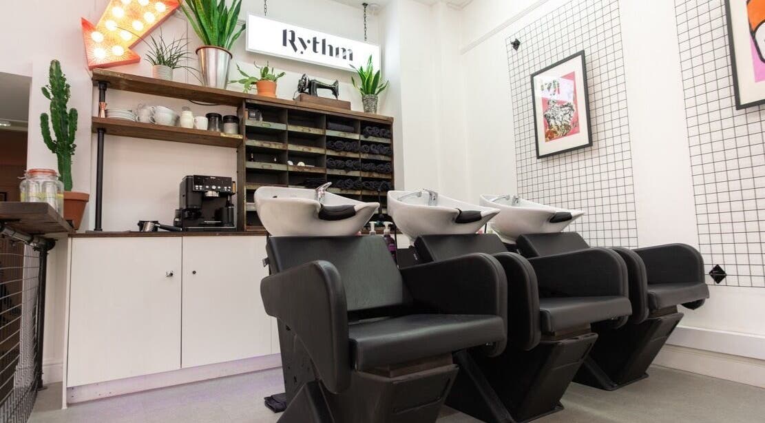 Modern salon interior at Rythm Studio, Bristol, England, GB, featuring stylish wash stations and decor.