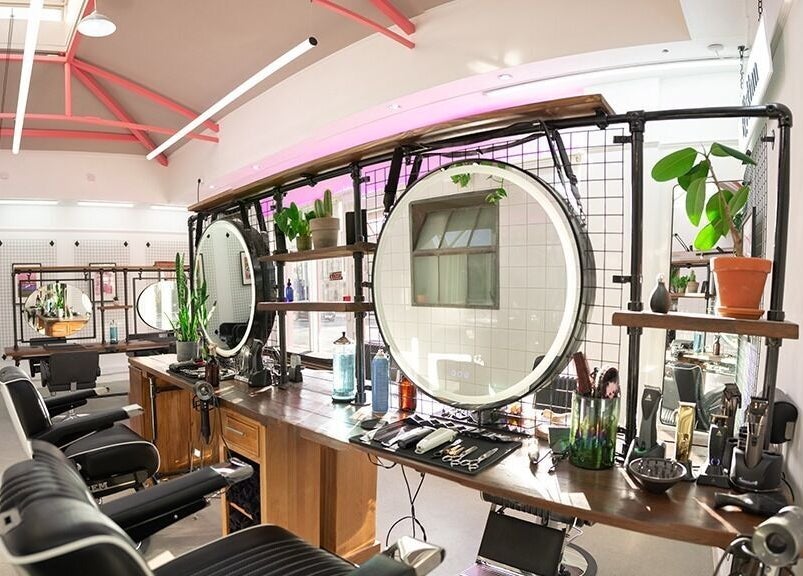 Rythm Studio's modern interior in Bristol, England, GB with sleek styling stations and ambient lighting.