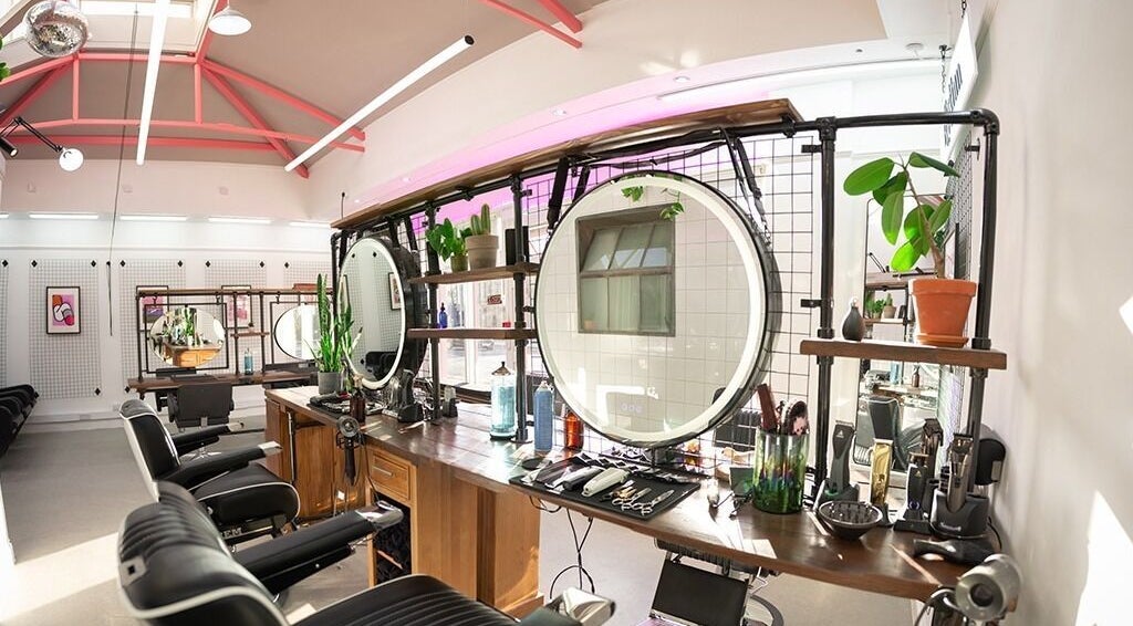 Rythm Studio's modern interior in Bristol, England, GB with sleek styling stations and ambient lighting.