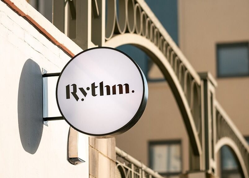 Rythm Studio signboard on building exterior in Bristol, England, GB, showcasing modern design.