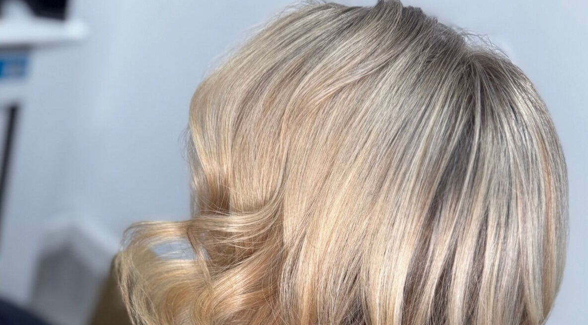 Elegant blonde waves styled at Anna Chiesa Hair, Motherwell, Scotland, GB.