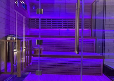 Illuminated sauna room at Recovery Space, Dubai, Dubai, AE, offering a relaxing wellness experience.