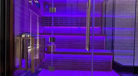 Illuminated sauna room at Recovery Space, Dubai, Dubai, AE, offering a relaxing wellness experience.
