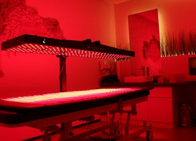Relaxing red light therapy room at Recovery Space, Dubai, Dubai, AE offering wellness and tranquility.