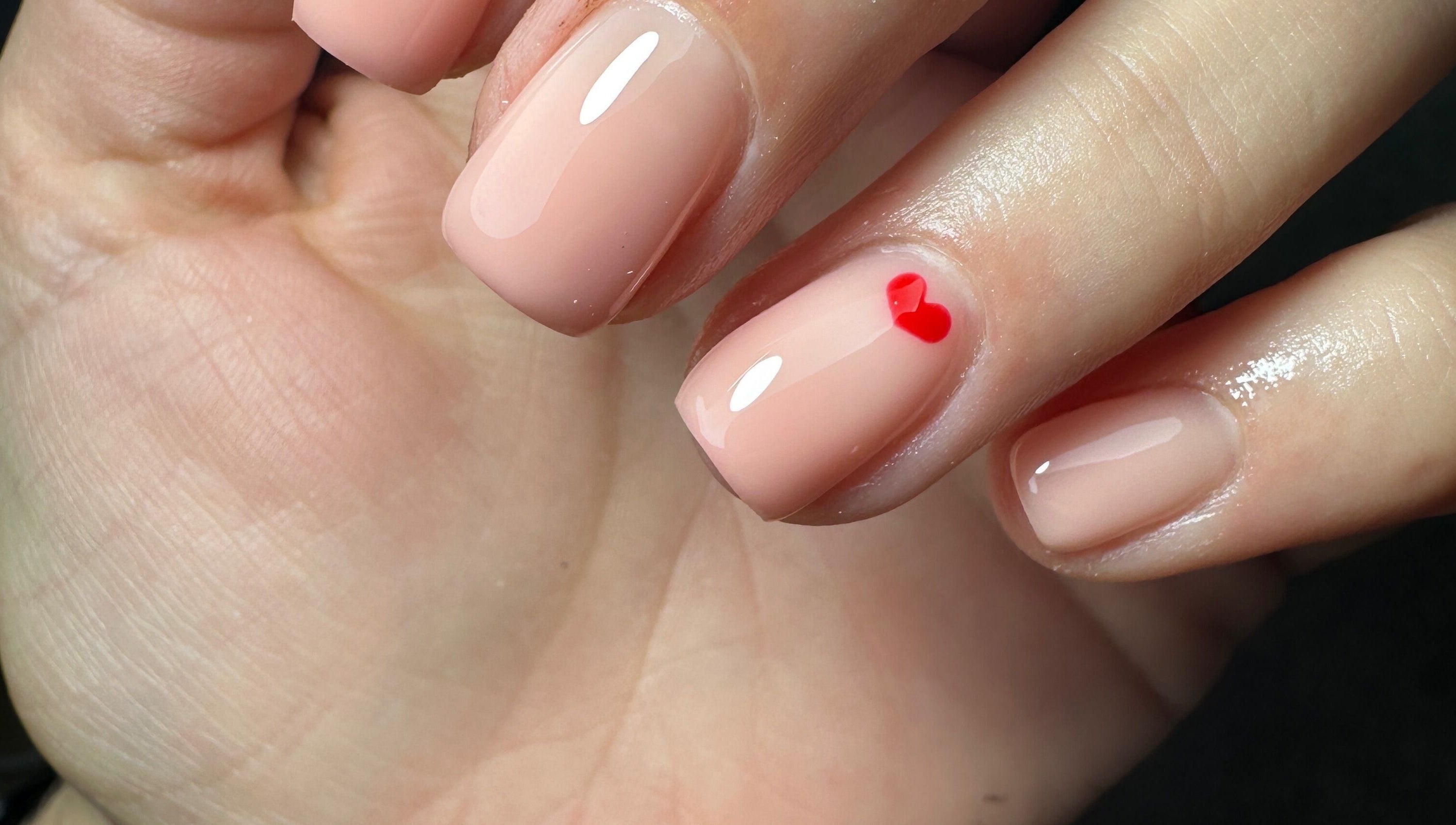 Elegant nail design with heart detail at Sage Beauty & Aesthetics, Wigan, England, GB.