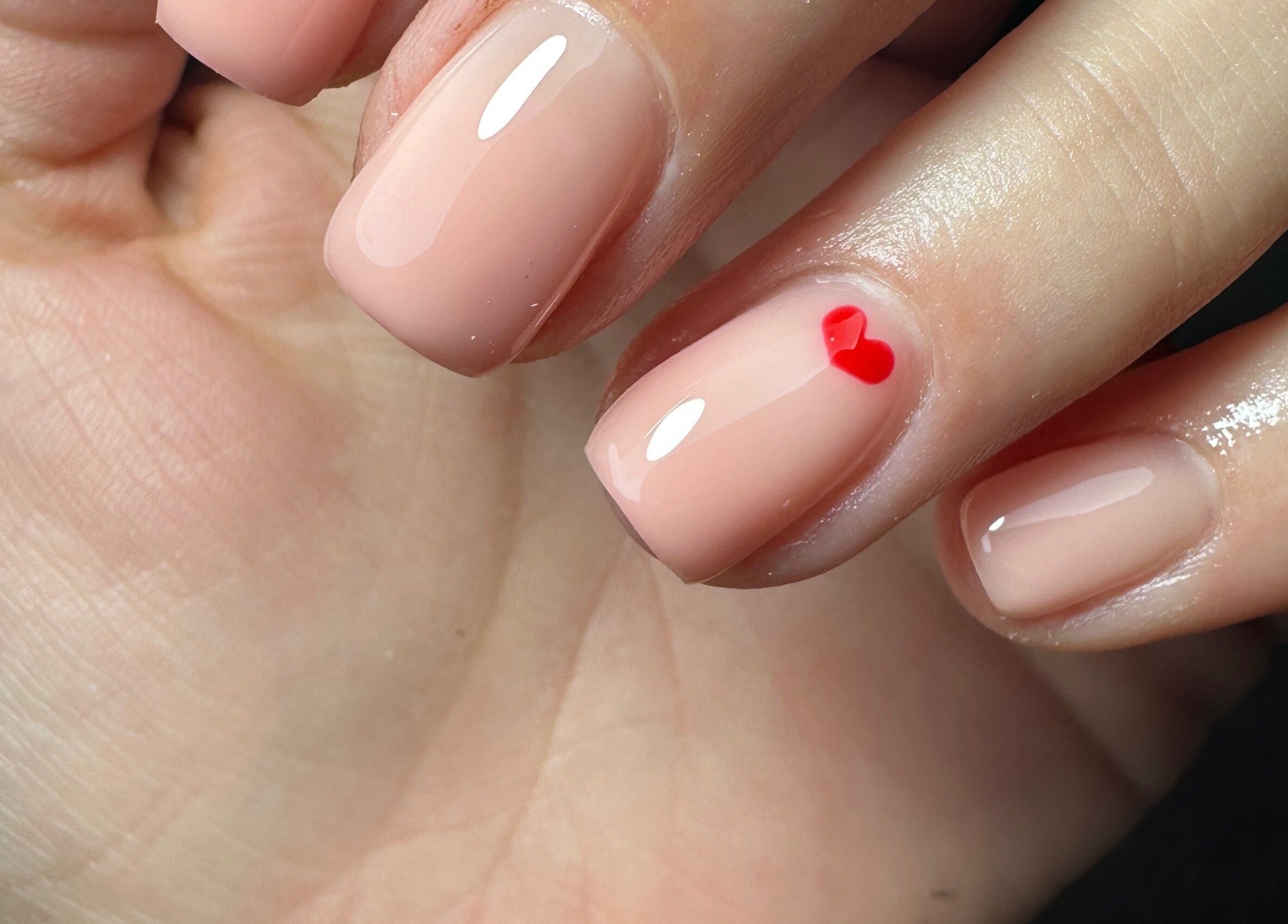 Elegant nail design with heart detail at Sage Beauty & Aesthetics, Wigan, England, GB.