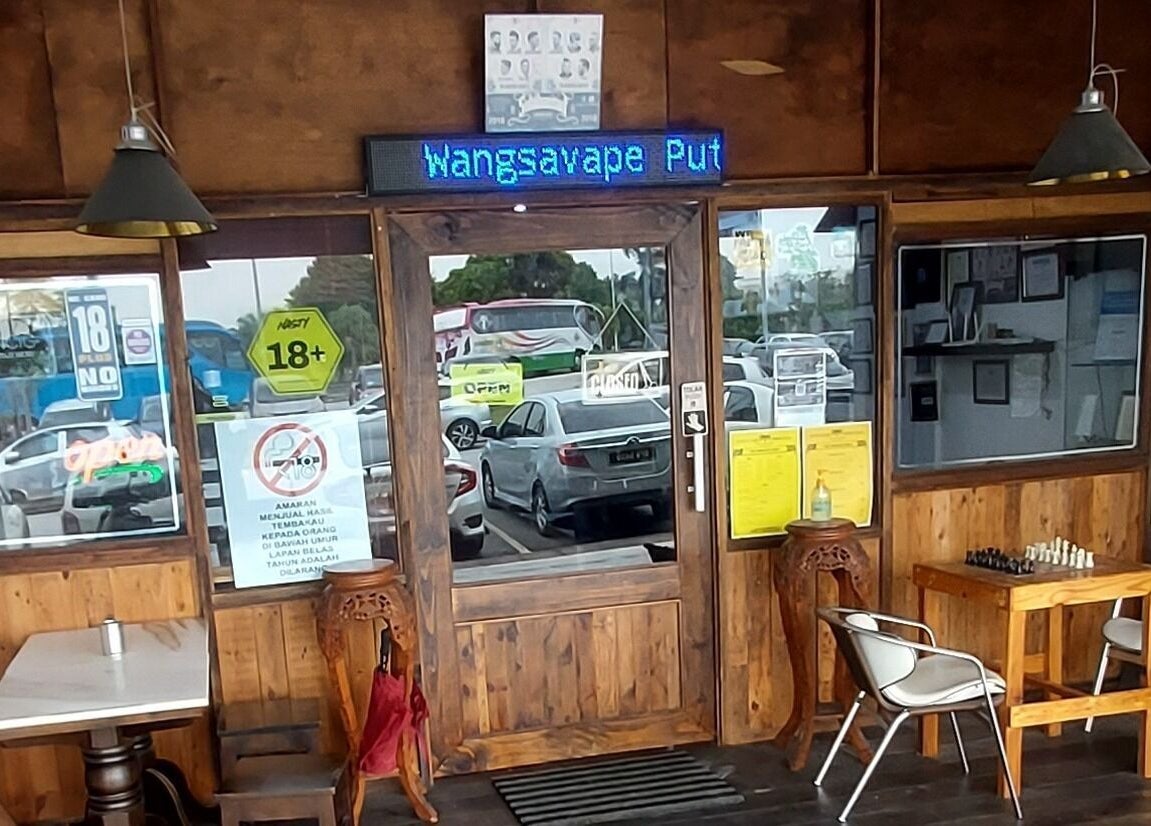 Entrance of Sohibussaif Barbershop in Subang Jaya, Selangor, MY featuring wood decor and a chess table.