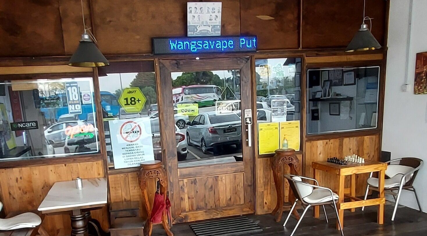 Entrance of Sohibussaif Barbershop in Subang Jaya, Selangor, MY featuring wood decor and a chess table.