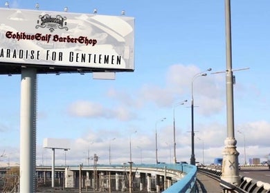 Billboard for Sohibussaif Barbershop in Subang Jaya, Selangor, MY, advertising 'A Paradise for Gentlemen'.