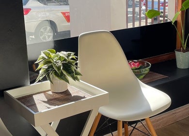 Bright seating area with plants at JMS Wellness Durbanville, Cape Town, Western Cape, ZA, inviting relaxation.
