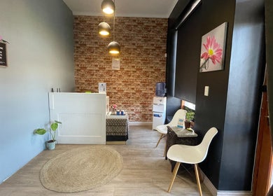 Reception area at JMS Wellness Durbanville, Cape Town with modern decor and seating in Western Cape, ZA.