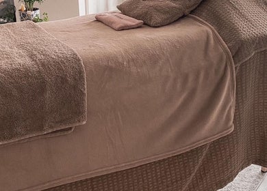 Comfortable massage table at Let's Breathe Complementary Therapies in Hockley, England, GB.