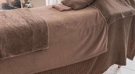 Comfortable massage table at Let's Breathe Complementary Therapies in Hockley, England, GB.