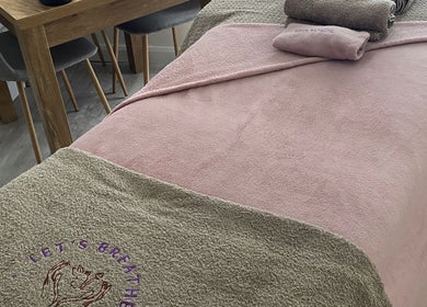 Cozy therapy bed at Let's Breathe Complementary Therapies in Hockley, England, GB.