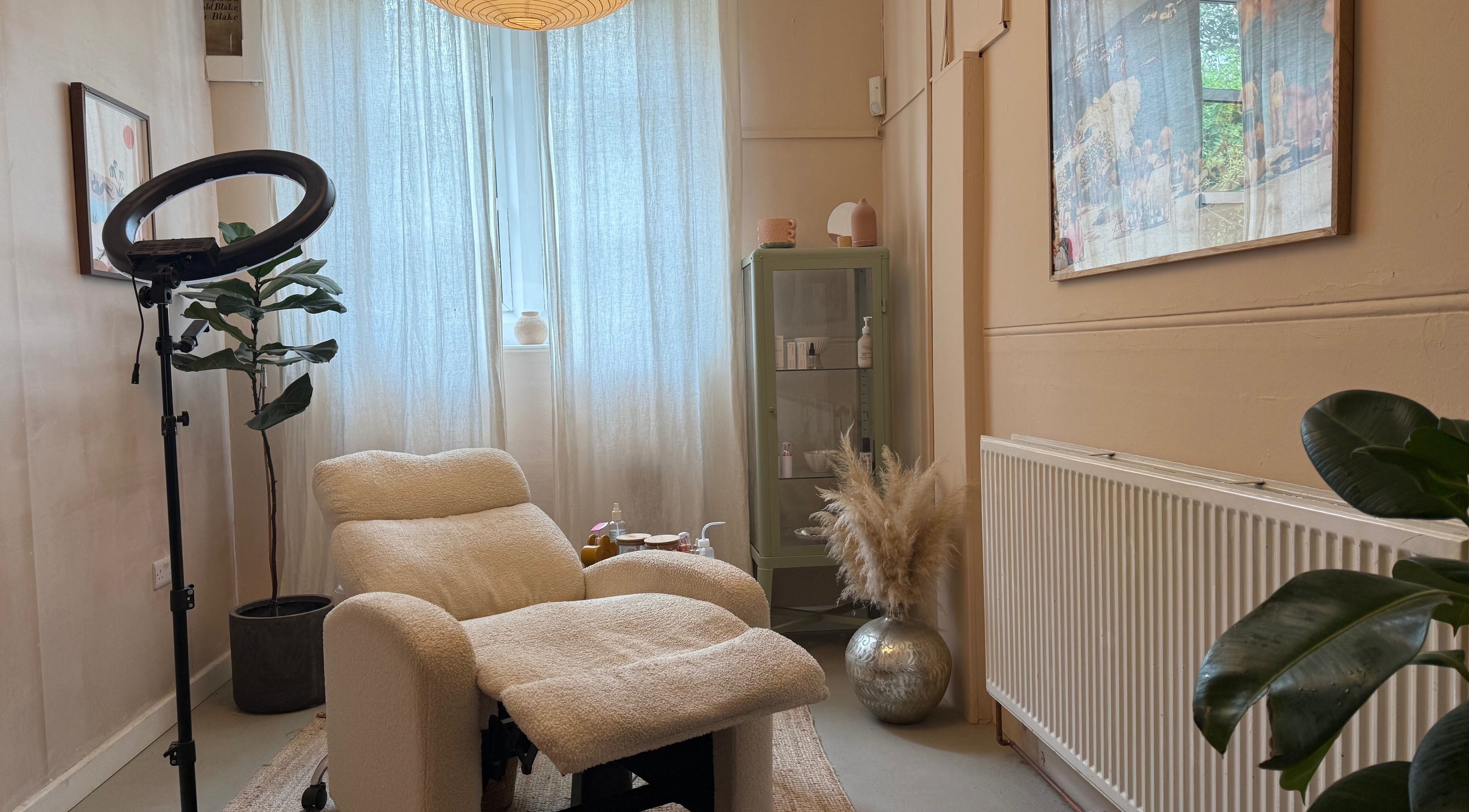 Relaxing treatment room at The Lash Place - Bath, featuring plush chair and serene decor in Bath, England, GB.