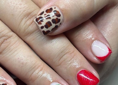 Stylish leopard and red French nail art at Beaux Bespoke in Dublin, County Dublin, IE.