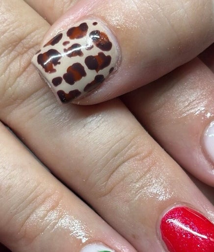 Stylish leopard and red French nail art at Beaux Bespoke in Dublin, County Dublin, IE.