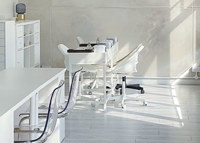 Modern, minimalist interior of Soso Beauty in Liverpool, England, GB offering a serene and elegant workspace.