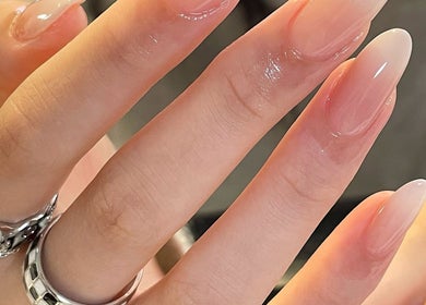 Elegant manicure at Soso Beauty, Liverpool, England, GB, enhances nail aesthetics with a glossy finish.