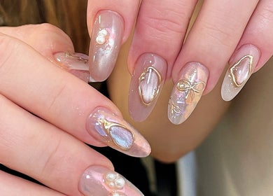 Intricate nail art with pearl details at Soso Beauty, Liverpool, England, GB.