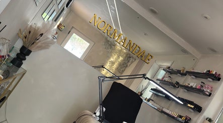 Elegant interior of Normandaé Studio in Saltash, England, showcasing stylish decor and beauty products on display.