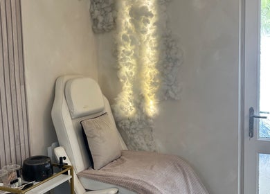 Relaxing chair with soft lighting at Normandaé Studio, Saltash, England, GB, highlighting serene ambience.