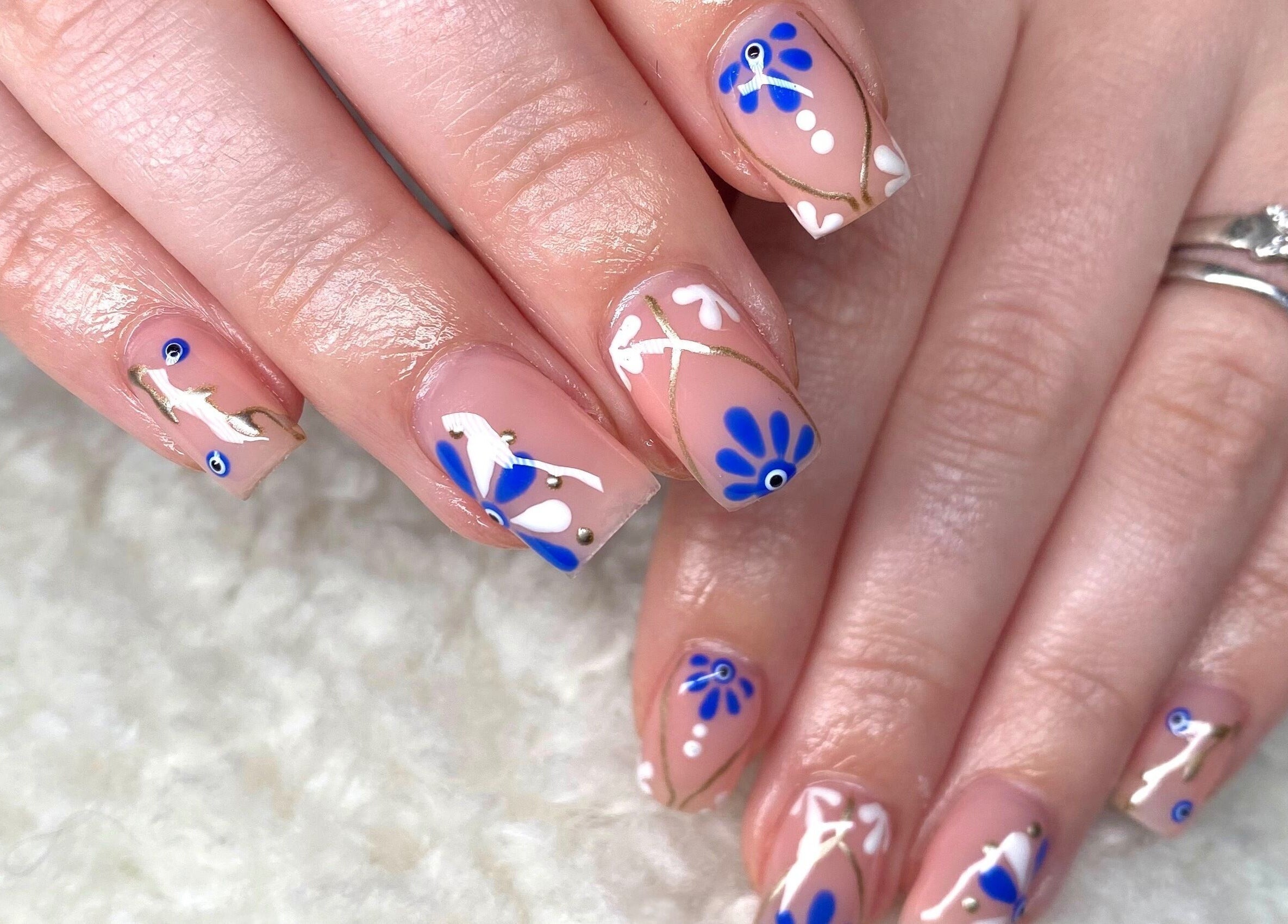 Blue floral nail art at Normandaé Studio, Saltash, England, GB.