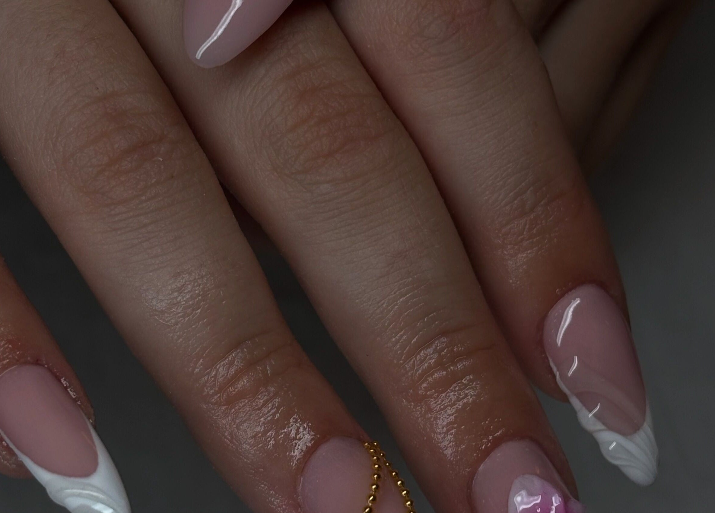 Stylish nail art at Normandaé Studio, Saltash, England, GB, showcasing intricate French manicure designs.