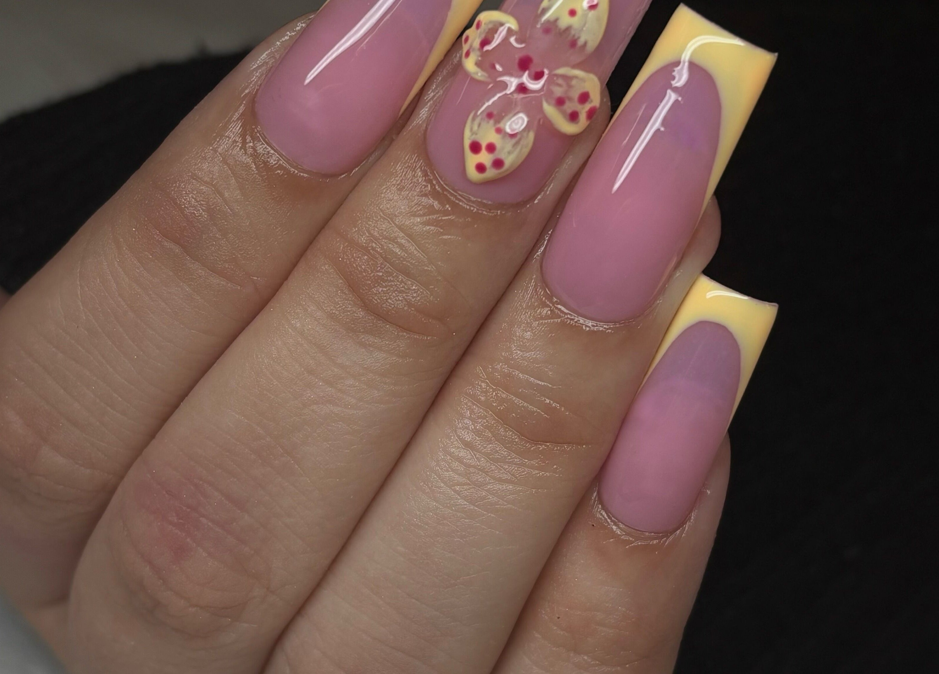 Elegant floral nail art at Normandaé Studio, Saltash, England, GB, showcasing exquisite manicure design.