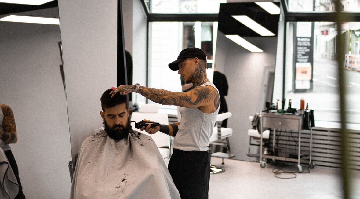 Amiro Barbershop in Zürich, Zürich, CH provides expert barbering services in a sleek, modern interior.