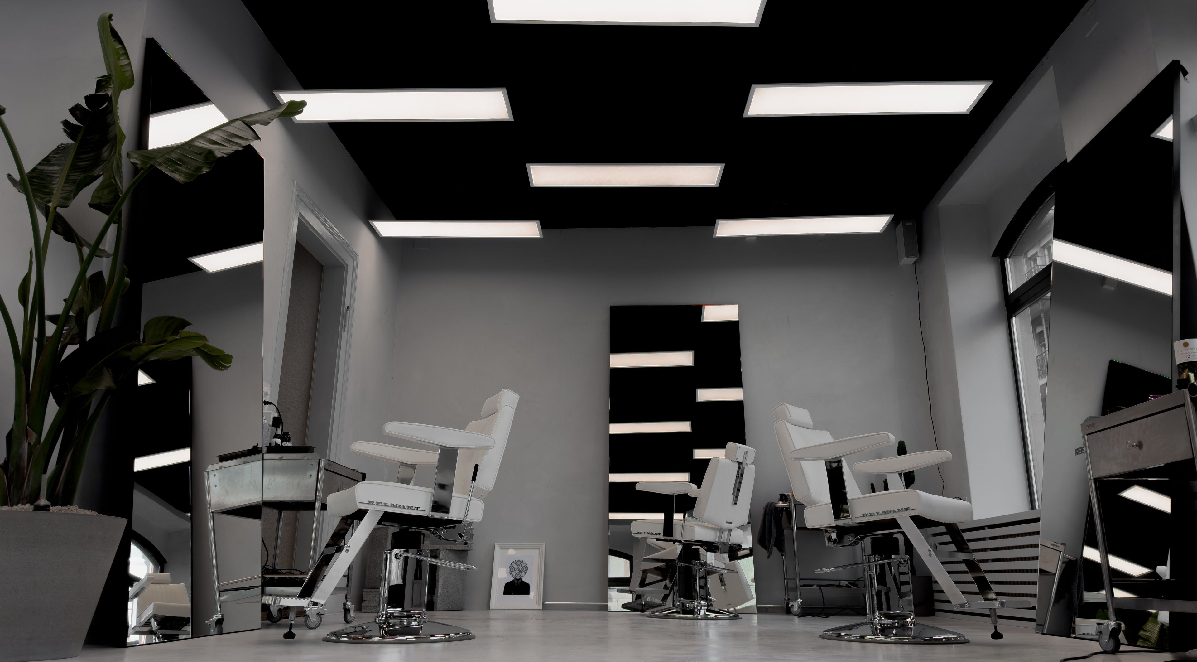 Stylish interior of Amiro Barbershop in Zürich, Zürich, CH featuring chic barber chairs and modern decor.