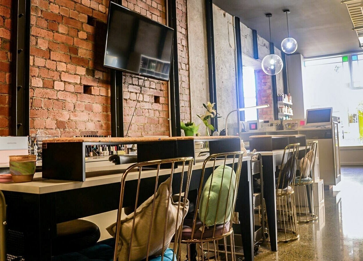 Modern beauty lounge at Studio V, Lower Hutt, Wellington, NZ with stylish decor and cozy seating.