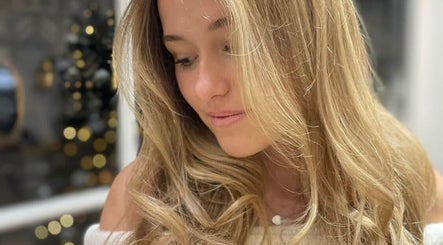 Woman with styled blonde hair at Hair By Helena, Nantwich, England, GB, showcasing expert hairdressing.