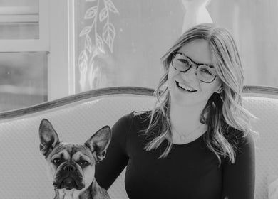Woman with dog at The Beauty Loft, Marmora, Ontario, CA, in a serene, stylish setting.