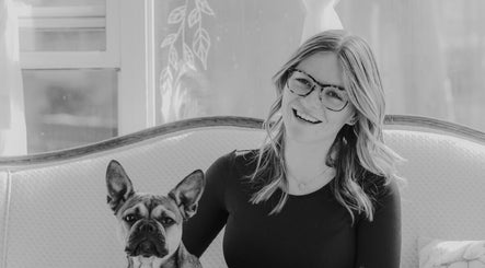 Woman with dog at The Beauty Loft, Marmora, Ontario, CA, in a serene, stylish setting.