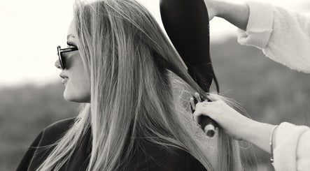 Hair styling session at The Beauty Loft in Marmora, Ontario, CA, showcasing expert blow-drying skills.