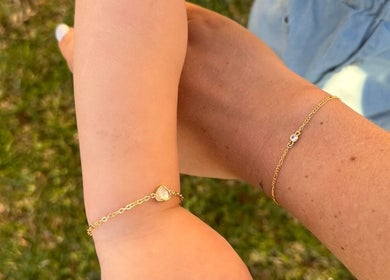 Two hands with gold bracelets at Indie Bookworm Event, Melbourne, Victoria, AU.