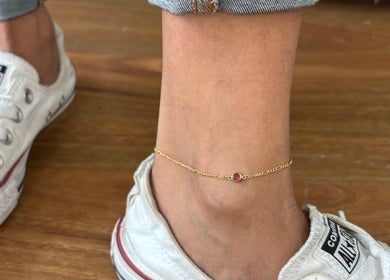 Stylish gold anklet on sneaker-clad foot at Indie Bookworm Event, Melbourne, Victoria, AU.