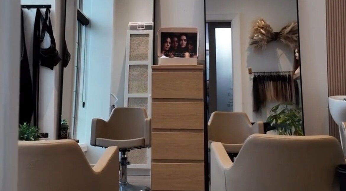 Elegant salon interior at The Wig Whisperer Hair Company, Oakville, Ontario, CA, showcasing modern hairstyling chairs.