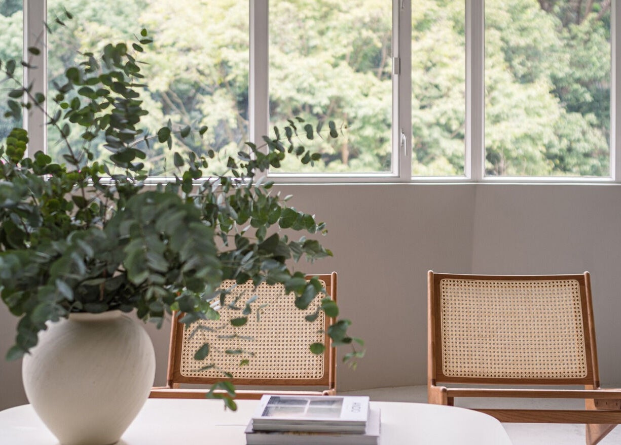 Bright, relaxing seating area with large windows at ACME Wellness Hong Kong, Hong Kong Island, HK.