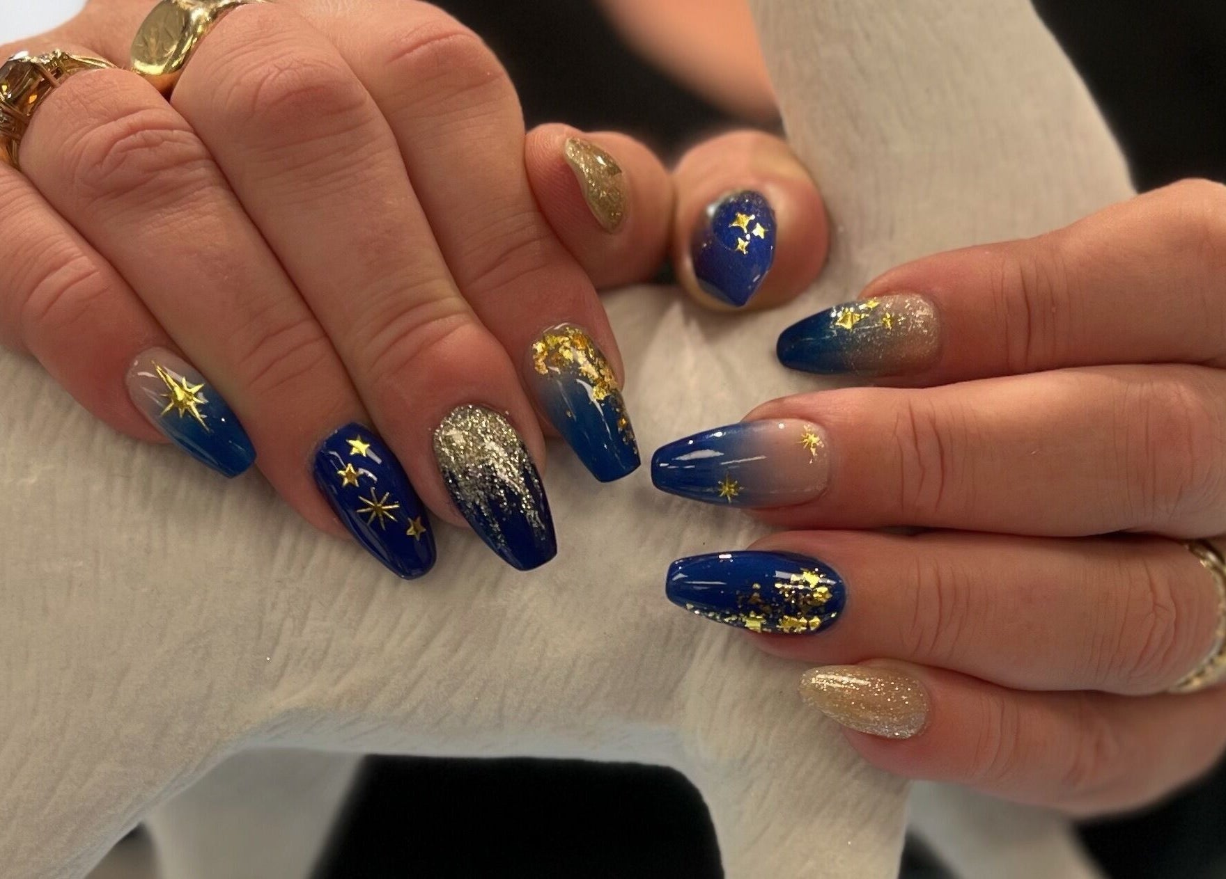 Elegant celestial-themed nails with blue and gold accents at Nails and Tails, Clevedon, England, GB.