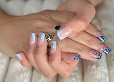 Elegant nail art with blue accents at Nails and Tails, Clevedon, England, GB.