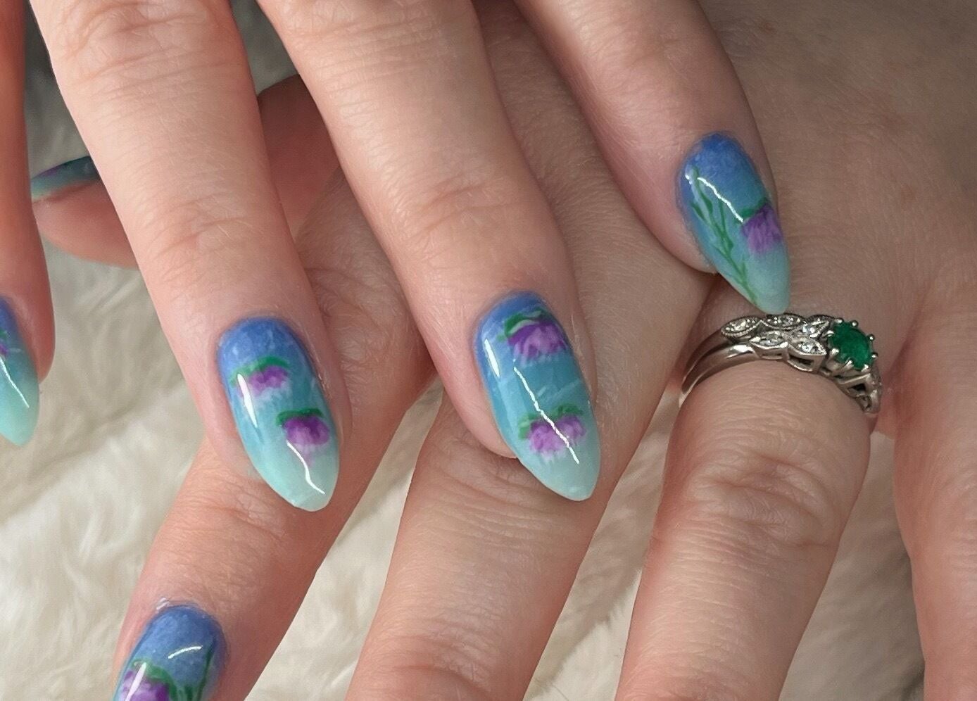 Elegant blue and purple floral nail art at Nails and Tails in Clevedon, England, GB.