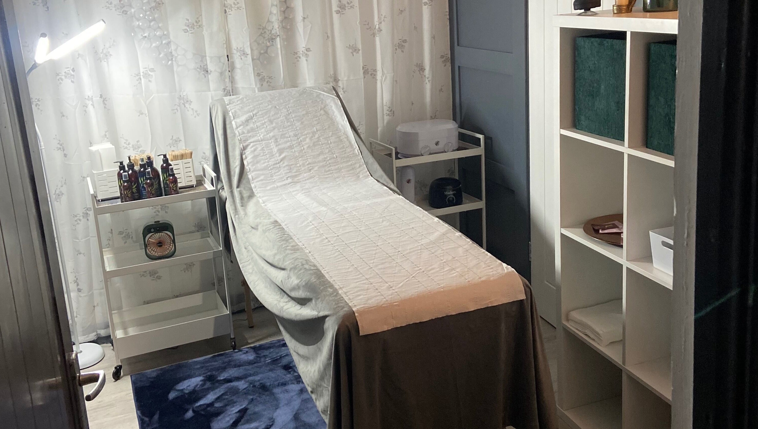 Relaxing treatment room at Simply Wax, Ballyclare, Northern Ireland, GB, featuring a comfortable treatment bed.