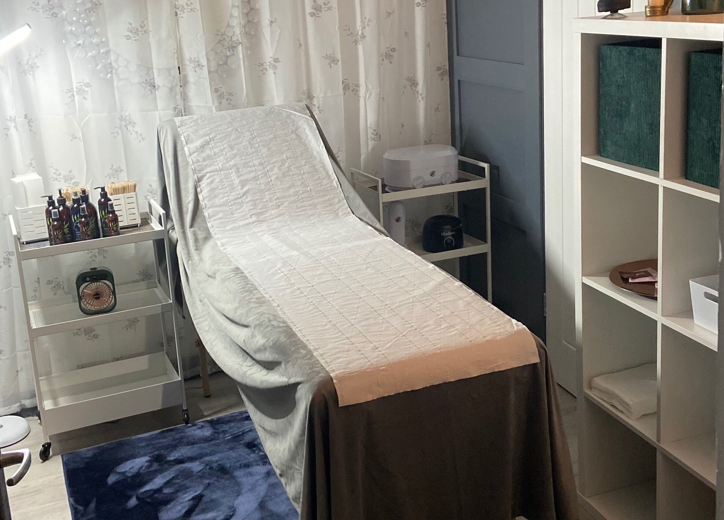 Relaxing treatment room at Simply Wax, Ballyclare, Northern Ireland, GB, featuring a comfortable treatment bed.